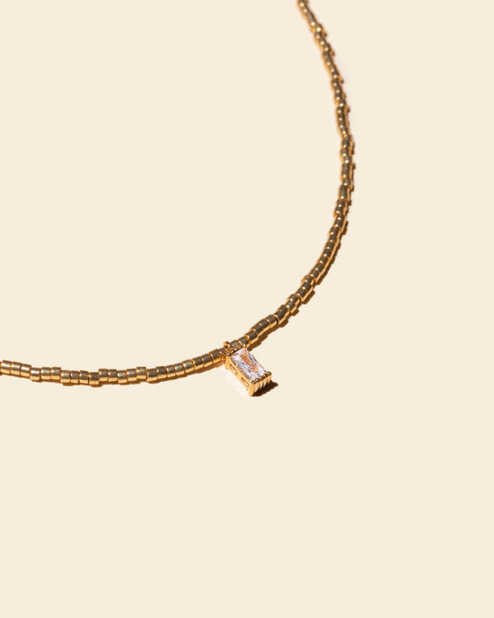 Load image into Gallery viewer, Collier perles dorées pendentif brillant
